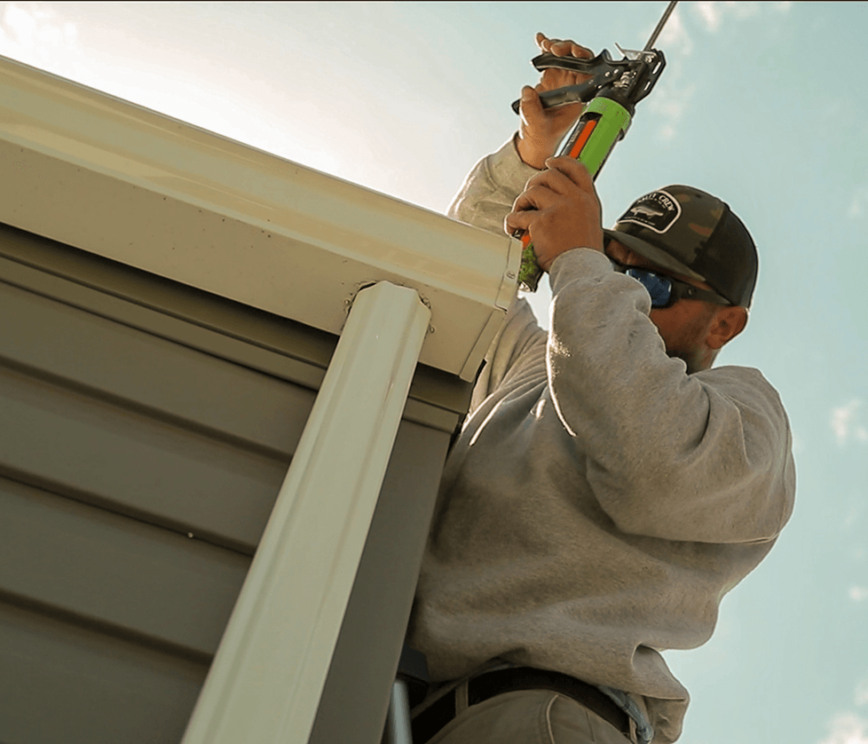 Man putting on shingles