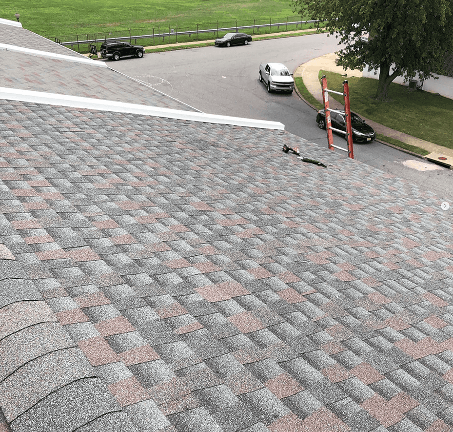 Man putting on shingles