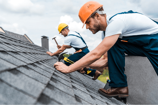 Man putting on shingles