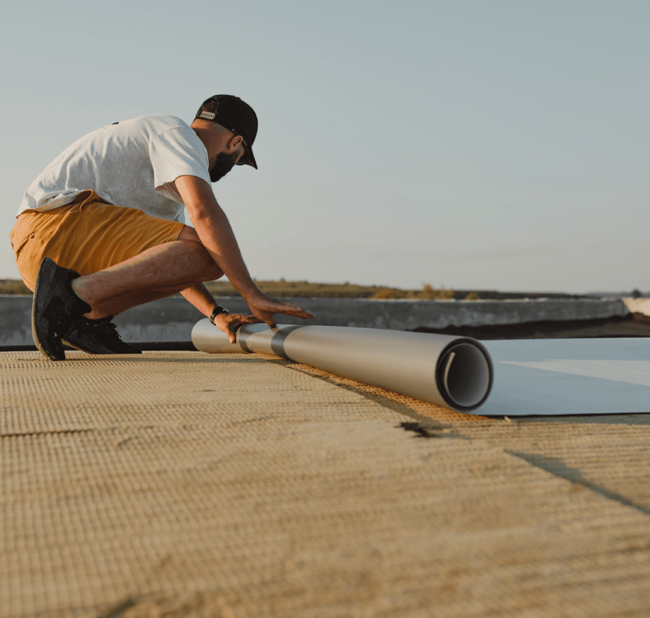 Man putting on shingles